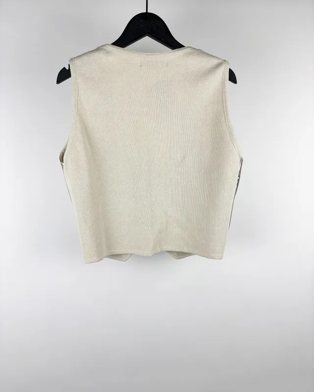 Chaleco dorado y crudo alejandra iglesias