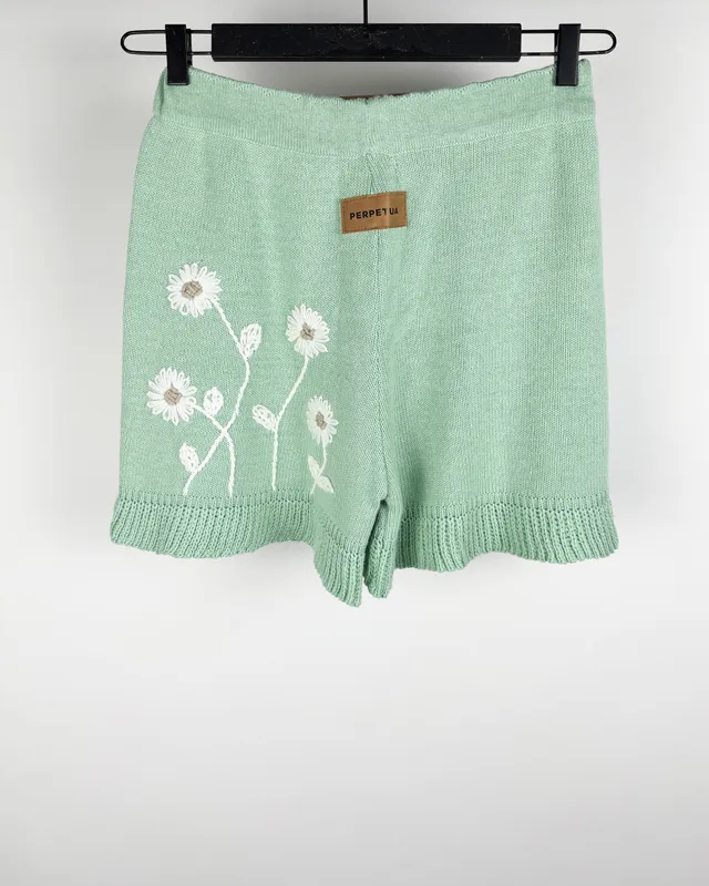 Short  verde agua c/flores perpetua