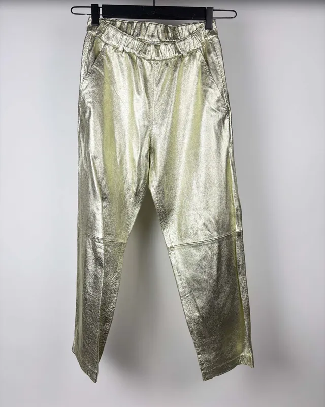 Pantalon dorado zurra