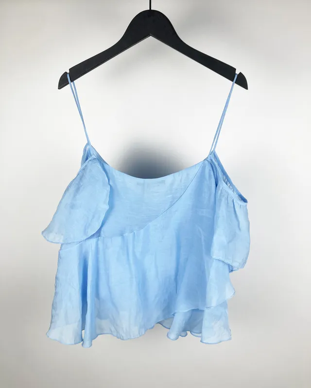 Blusa celeste bf c/volado zara