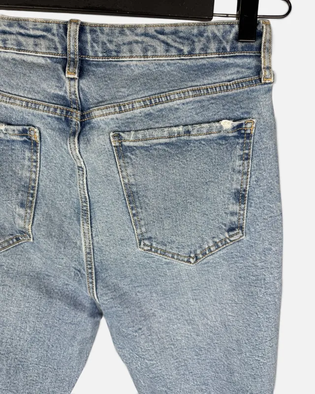 Jean celeste con roturas zara
