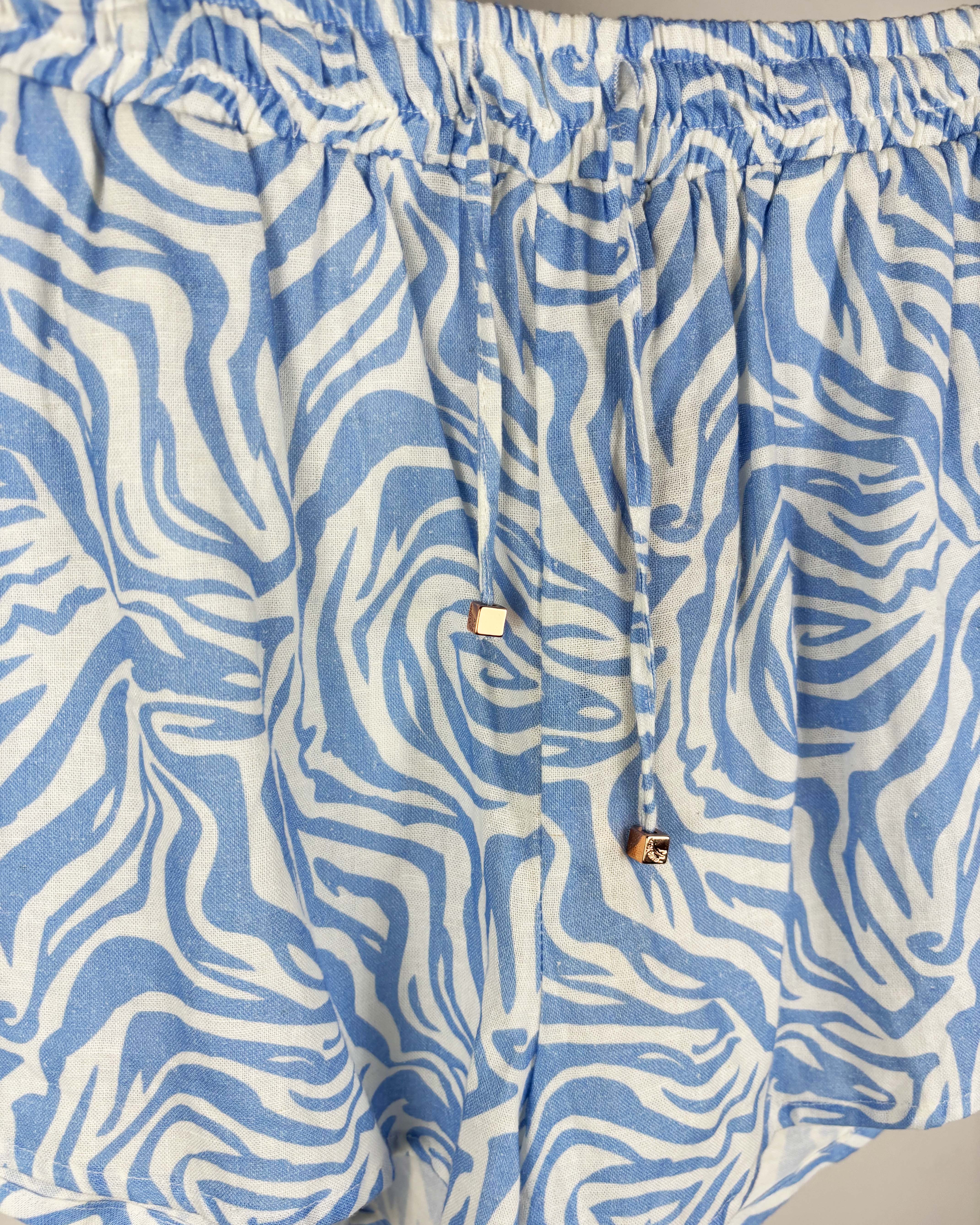 Short tipo lino crudo con estampa celeste polonio