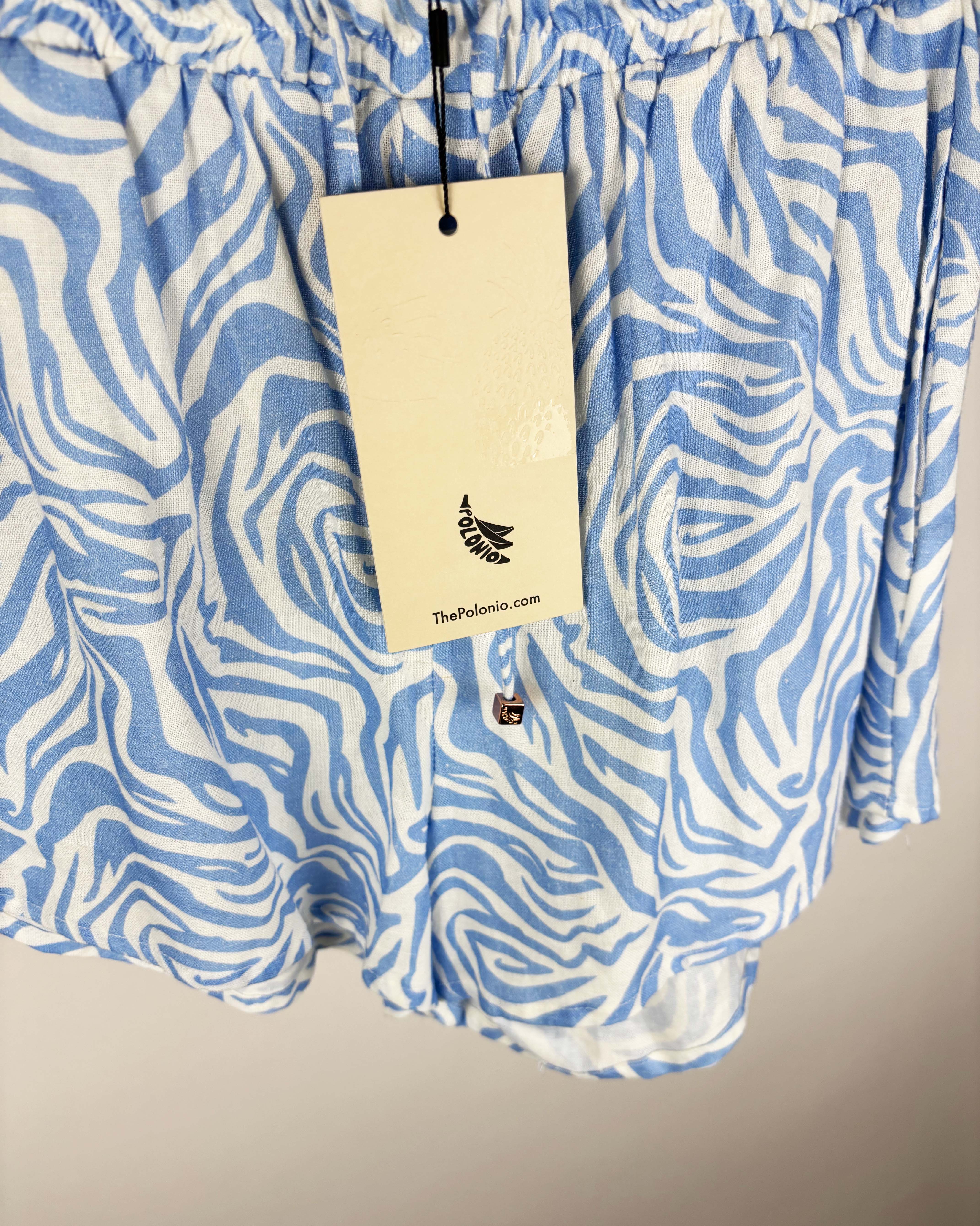 Short tipo lino crudo con estampa celeste polonio