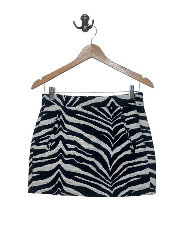 Mini falda tela con bolsillos cebra
