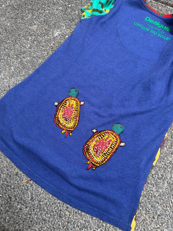 REMERA DESIGUAL x CIRQUE DU SOLEIL