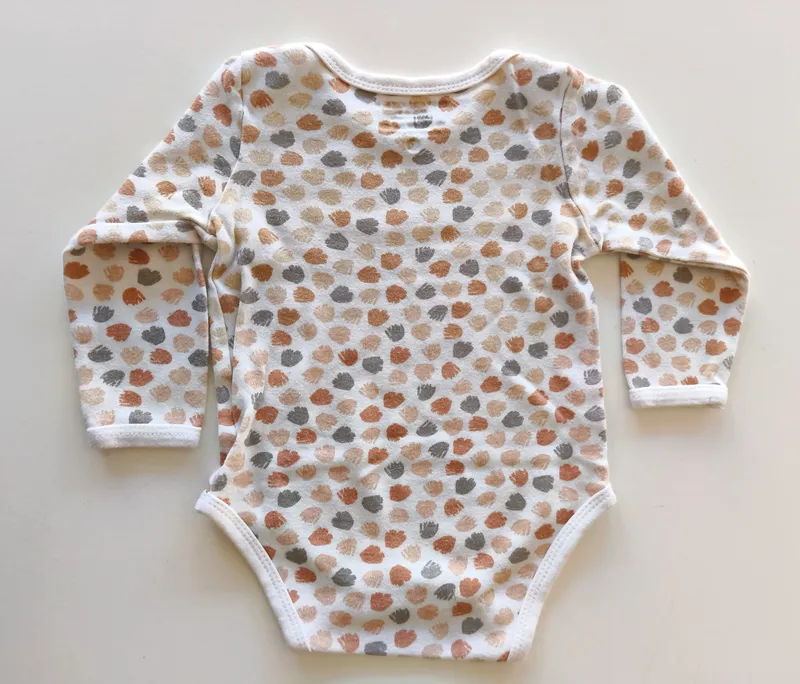 Body manga larga. Bronzini. Talle 9 - 12 meses.