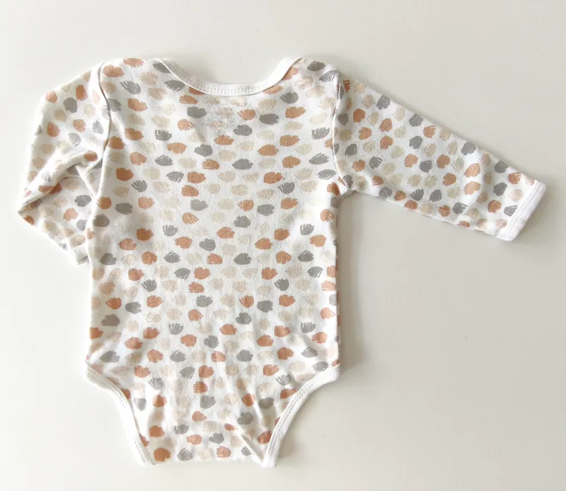 Body manga larga. bronzini. talle: 0 - 3 meses.