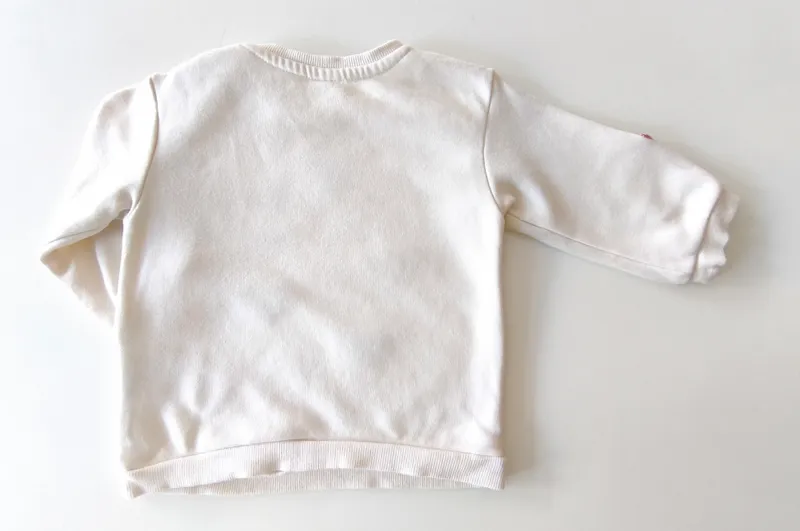 Buzo. h&m. talle: 6 - 9 meses.