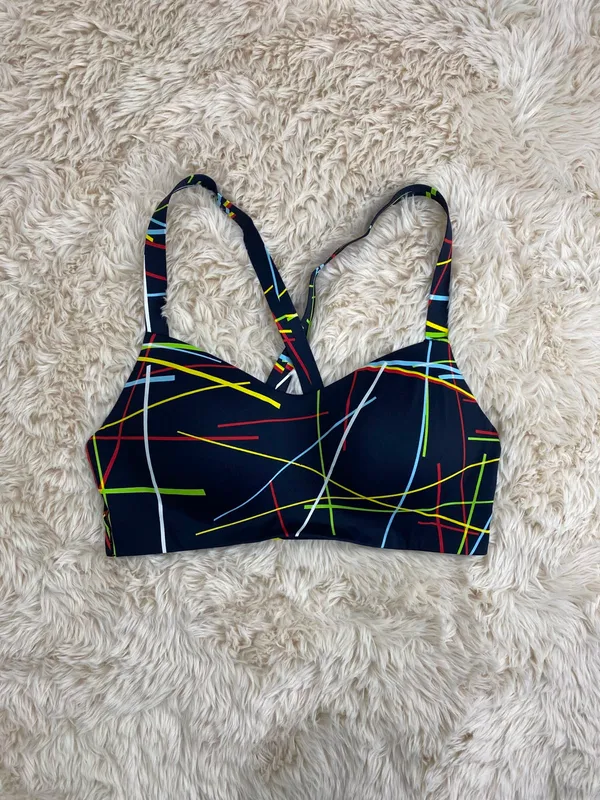 Top deportivo azul con rayas de colores uniqlo tl