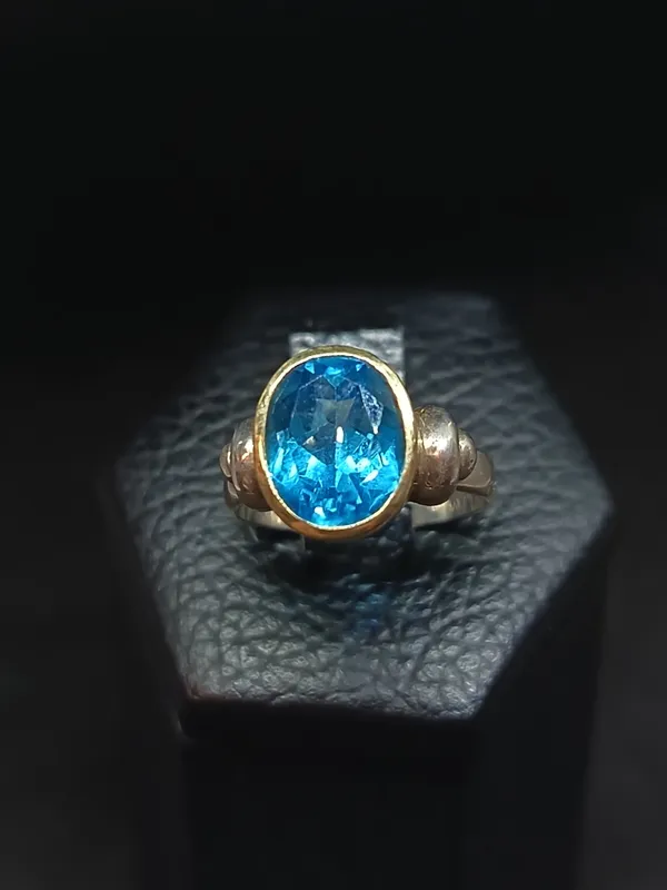 Anillo plata con piedra central celeste
