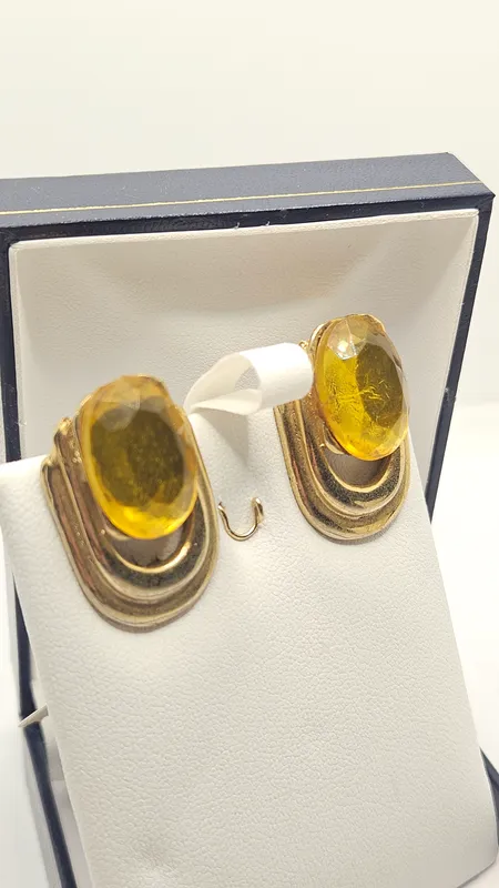 Par de aros caravanas de clip con piedras amarillas